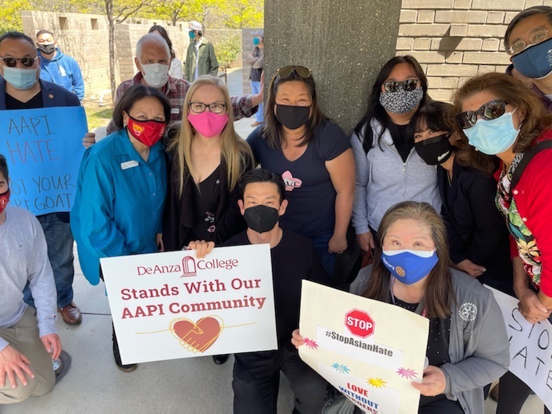 Group with signs against racism