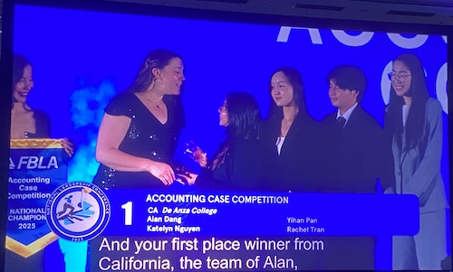 Woman presenting award to FBLA accounting team members 