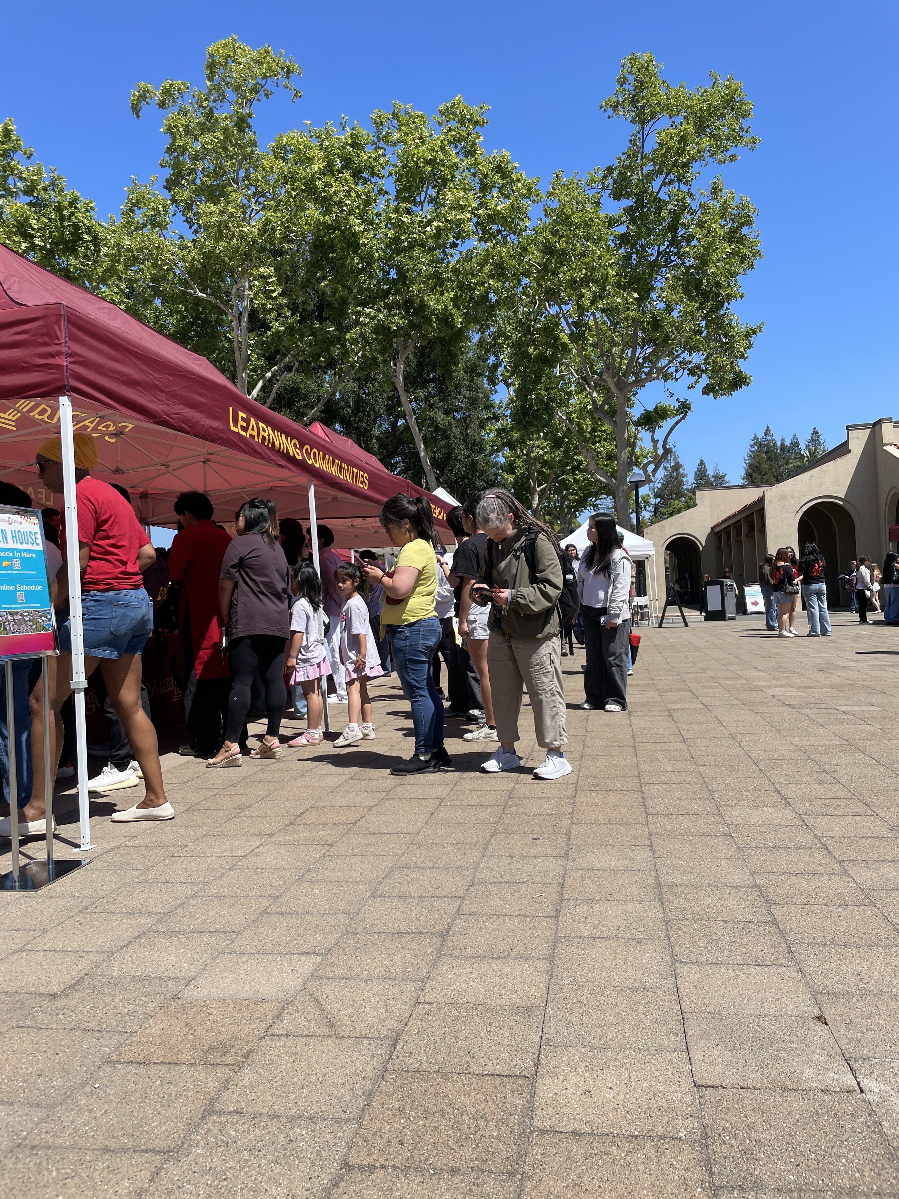Open House 2026 attendees visit student services tents in the Main Quad