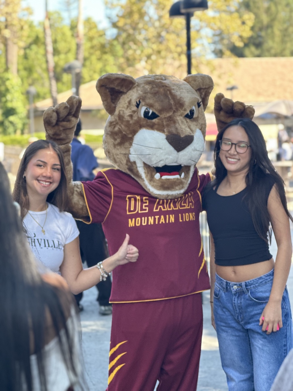 Roary with two young women at Welcome Day in 2024